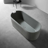 LIORA - Baignoire îlot cannelée en pierre artificielle