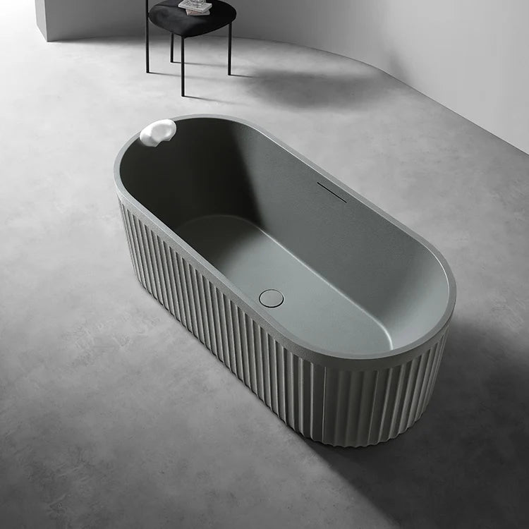 LIORA - Baignoire îlot cannelée en pierre artificielle