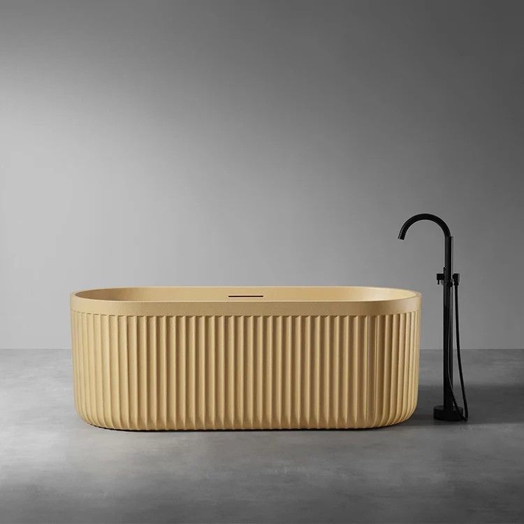 LIORA - Baignoire îlot cannelée en pierre artificielle