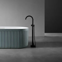 LIORA - Baignoire îlot cannelée en pierre artificielle